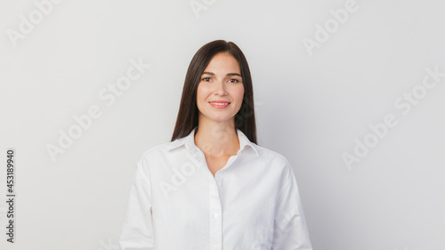 A young woman portrait isolated against a solid white background