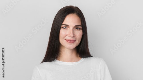 Beautiful brunette woman smiling. Female close-up portrait