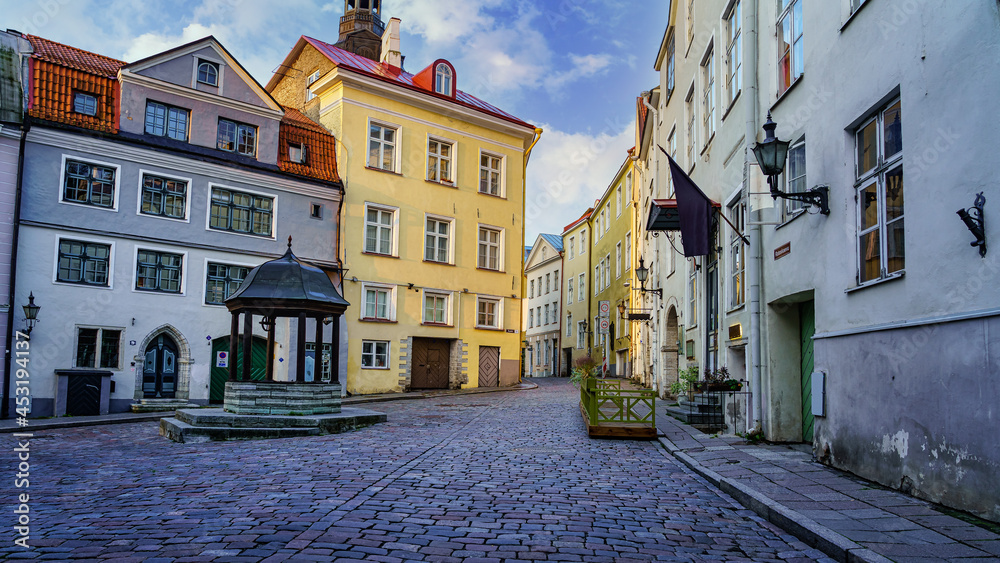 Medieval square at sunrise with old colored houses. Tallinn Estonia.