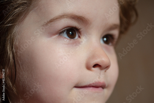Close-up portrait of cheerful child. Cute joyful little boy kid. Close up portrait of funny little child boy.