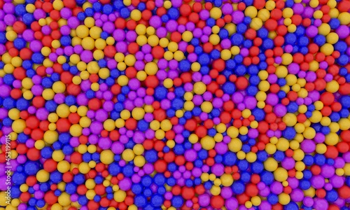 Piles of gumballs fill the screen with colorful balls. Multicolored plastic spheres in children's pool fun abstract background. 