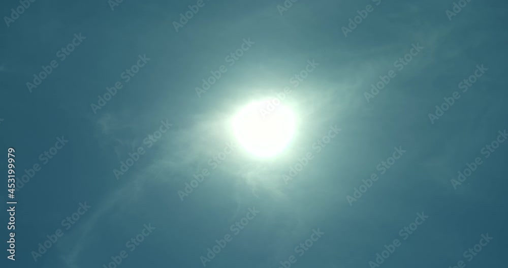 Close-up, the sun in a blue sky. Sun shines in the clouds, the air, the rays of the sun. Natural phenomenon. 4k, ProRes Close-up, the sun in a blue sky. Sun shines in the clouds, the air, the rays of the sun. Natural phenomenon. 4k, ProRes