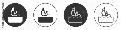 Black Windsurfing icon isolated on white background. Circle button. Vector