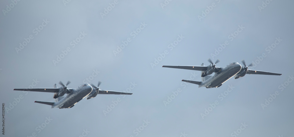 Small two twin-engine propeller military reconnaissance aircraft on a background of sky. Small two twin-engine propeller military reconnaissance aircraft on a background of sky.