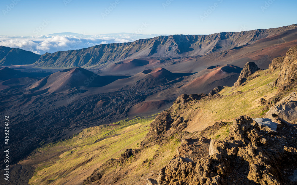 Looking down into the crater of Haleakalā Volcano, or the East Maui Volcano, which is a massive shield volcano that forms more than 75% of the Hawaiian Island of Maui. 