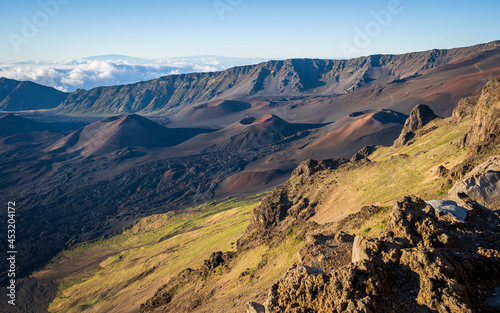 Looking down into the crater of Haleakalā Volcano, or the East Maui Volcano, which is a massive shield volcano that forms more than 75% of the Hawaiian Island of Maui. 