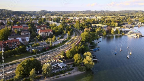 Train leaves the village of Starnberg. Many tourists and residents make a day trip by train from Munich to enjoy summer at Lake Starnberg