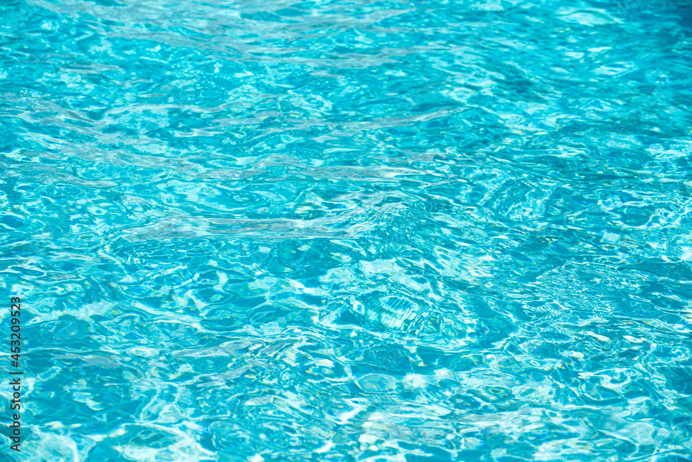 Abstract ripple wave and clear turquoise water surface in swimming pool, blue water wave for background and abstract design. Abstract ripple wave and clear turquoise water surface in swimming pool, blue water wave for background and abstract design.