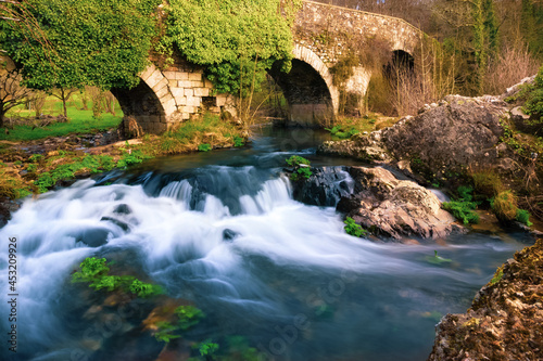 The Medieval Bridge Puente San Xoan across the River Furelos, outside the Town of Melide in Galicia, on the Way of St James Pilgrim Trail Camino de Santiago photo