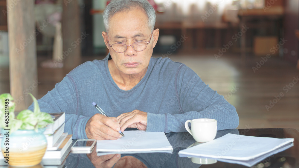 Asian senior man working at home