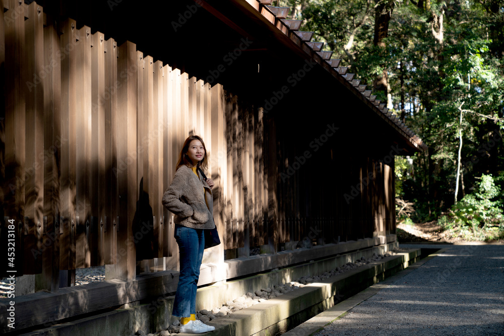 Happy Asian woman tourist walking in traditional Japanese old village and looking to beautiful nature in autumn. Smiling pretty girl relax and enjoy outdoor activity lifestyle travel vacation in Japan Happy Asian woman tourist walking in traditional Japanese old village and looking to beautiful nature in autumn. Smiling pretty girl relax and enjoy outdoor activity lifestyle travel vacation in Japan