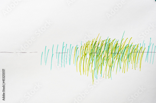 The drawn semblance of a sound wave. One horizontal line and many green vertical lines. photo