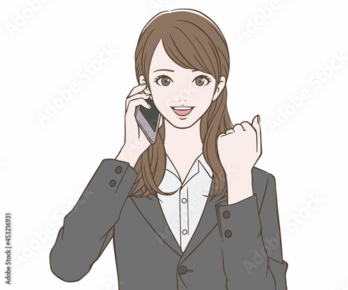スマートフォンを持ち、ガッツポーズをするスーツの女性