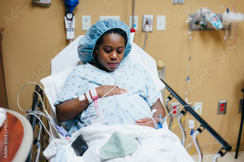 Woman in hospital before giving birth, pregnant  photo