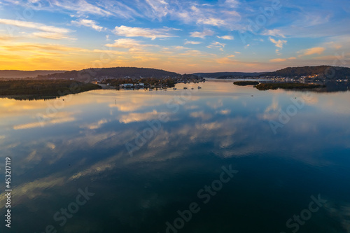 Sunrise waterscape with high cloud and reflections