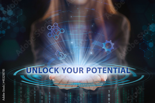 Business, Technology, Internet and network concept. Young businessman working on a virtual screen of the future and sees the inscription: Unlock your potential