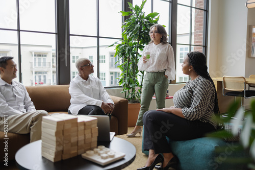 Diverse Business team meets in office, Mature Asian woman leadership  photo