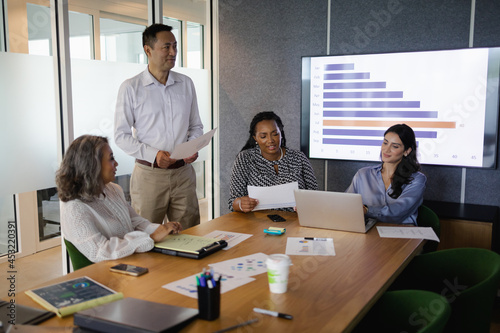 Diverse business team brainstorming and collaborates in conference room, senior Black woman leadership photo