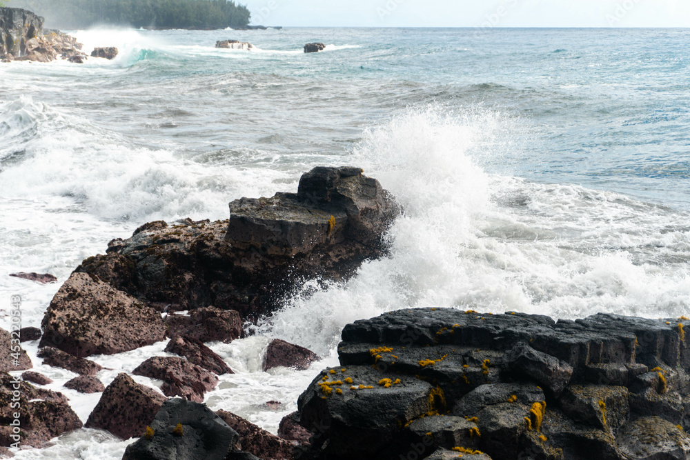 Black rocks being hit by waves Black rocks being hit by waves