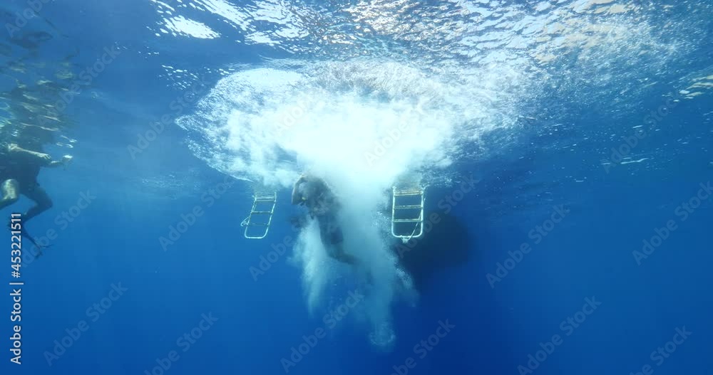 boat underwater scuba diver jumps into water ocean scenery Stock ビデオ Adobe Stock