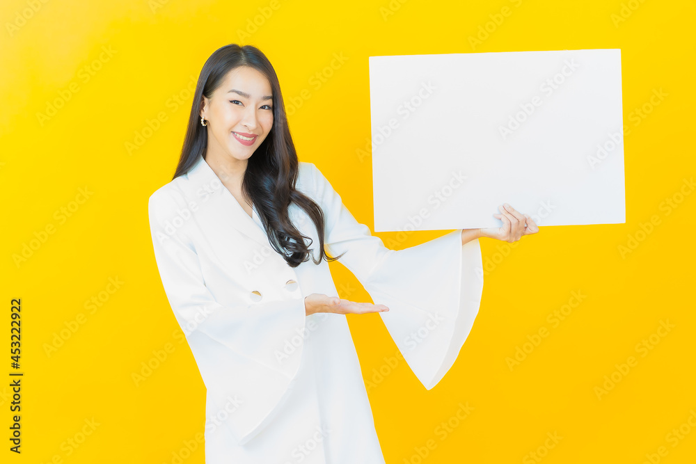 Portrait beautiful young asian woman with empty white billboard Portrait beautiful young asian woman with empty white billboard