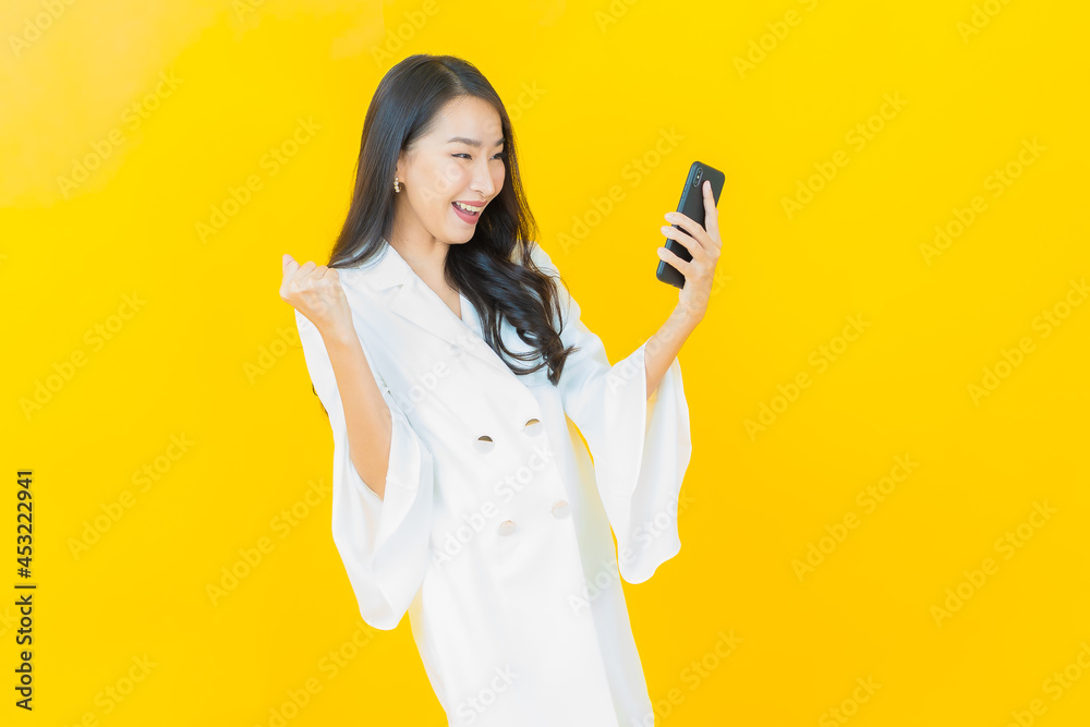 Portrait beautiful young asian woman smile with smart mobile phone