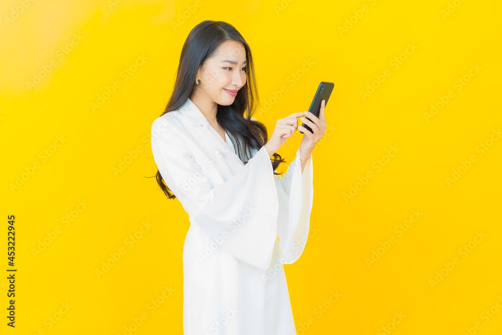 Portrait beautiful young asian woman smile with smart mobile phone Portrait beautiful young asian woman smile with smart mobile phone