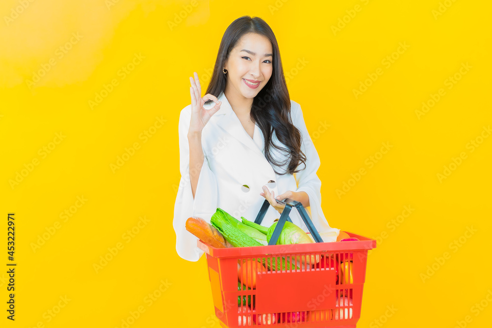 Portrait beautiful young asian woman smile with grocery basket Portrait beautiful young asian woman smile with grocery basket