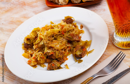 Home style stew of cabbage with pieces of pork. Traditional Ukrainian cuisine
