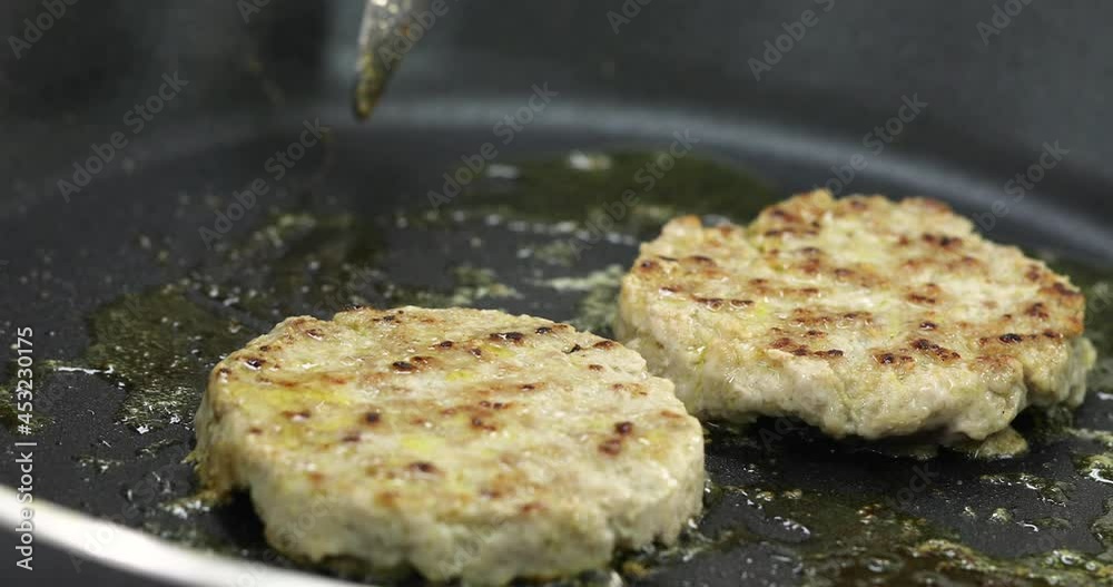 Raw pork on hot gas stove with melt butter for testy and good smell prepare ingredients for making homemade burger. Raw pork on hot gas stove with melt butter for testy and good smell prepare ingredients for making homemade burger.