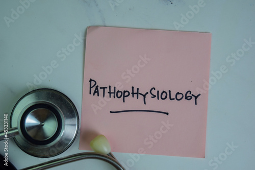Pathophysiology write on sticky notes isolated on Wooden Table. photo
