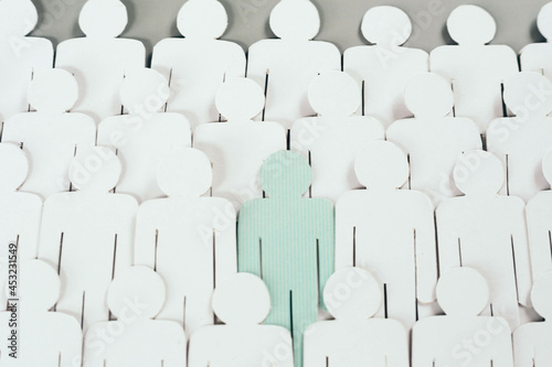 Wallpaper Mural Select employees from the crowd to suit the job. Focus on blue people standing with lots of normal people cutting paper on gray background. Torontodigital.ca