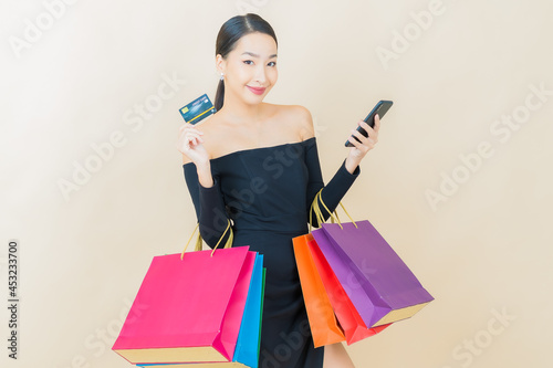 Portrait beautiful young asian woman smile with shopping bag