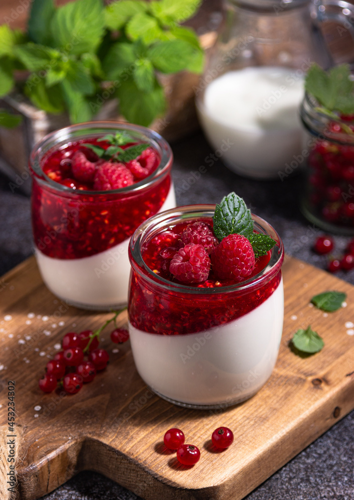 raspberry panna cotta with berries and mint, Italian dessert, home cooking. creamy dessert in a glass raspberry panna cotta with berries and mint, Italian dessert, home cooking. creamy dessert in a glass