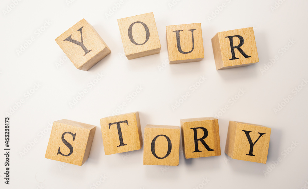 The word Your story was created from wooden cubes. psychology and human. The word Your story was created from wooden cubes. psychology and human.