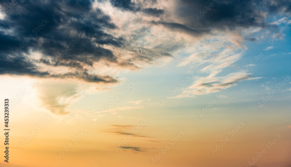 Stunning view of a dramatic sunset with some clouds. Romantic sky, natural background, Sardinia, Italy.