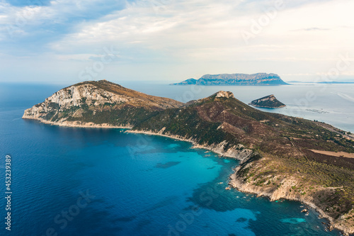 Stunning aerial view of Capo Figari bathed by a turquoise water. Capo Figari is a limestone promontory located in Gallura, in the north-east of Sardinia, Italy.