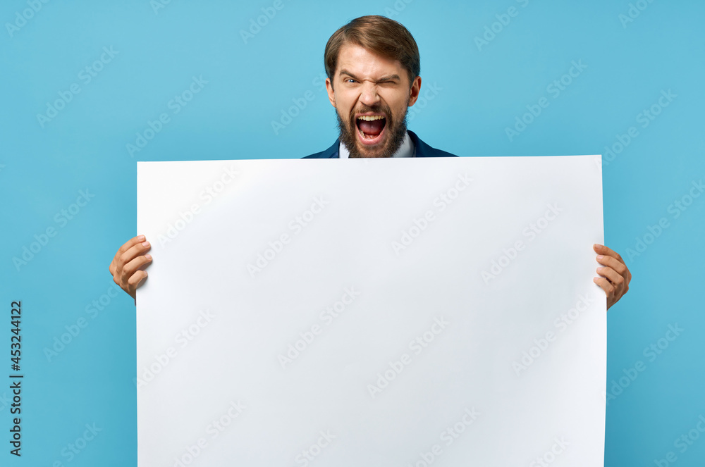 man with white poster advertising copy space blue background man with white poster advertising copy space blue background