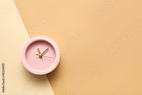Alarm clock on color backgr...