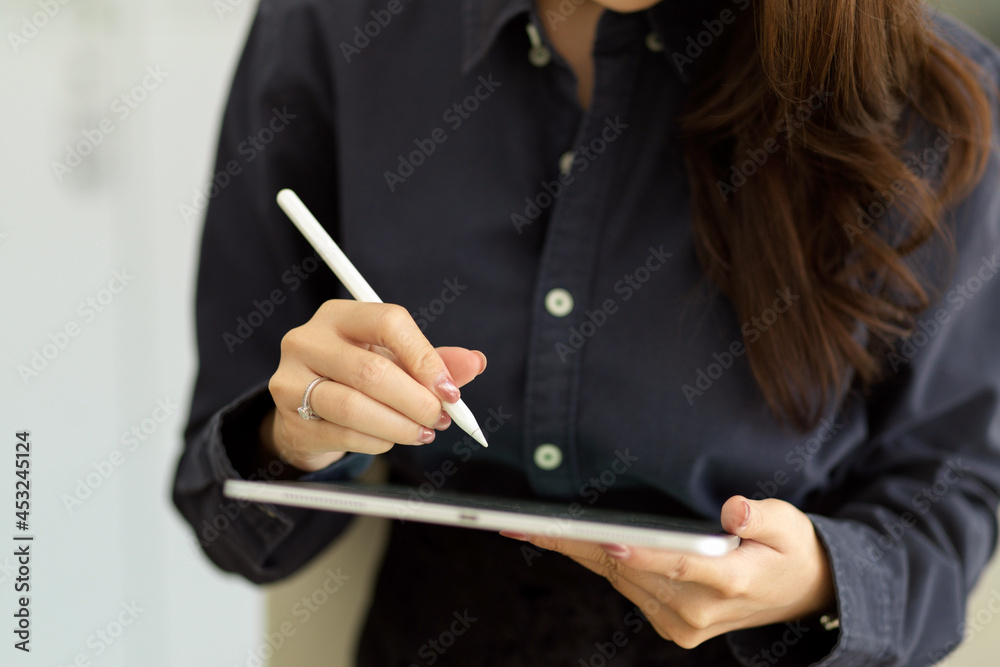 Female waitress taking customer order on tablet Female waitress taking customer order on tablet