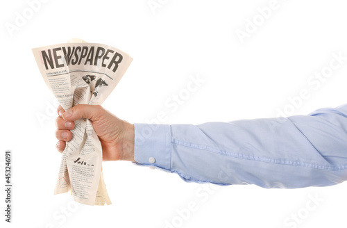 Male hand and crumpled news...