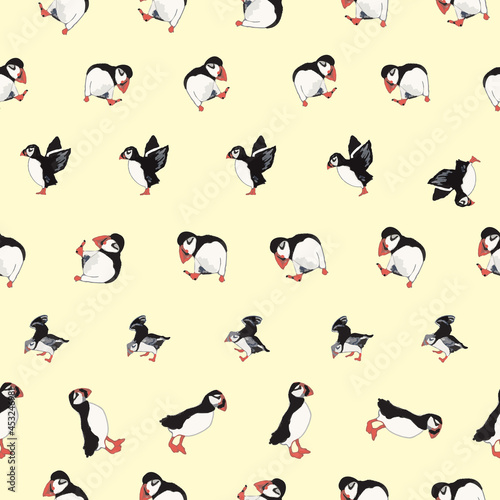 Vector yellow background ocean seabird, arctic birds, puffins. Seamless pattern background