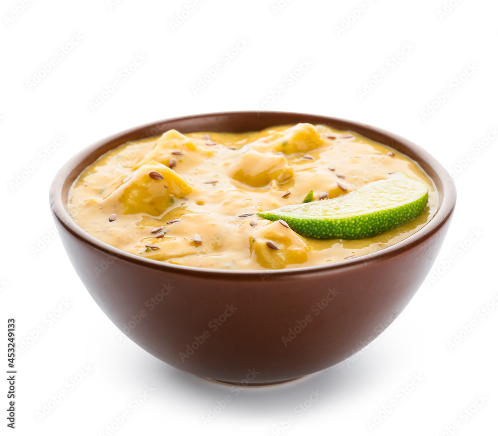 Bowl of tasty chicken curry on white background Bowl of tasty chicken curry on white background