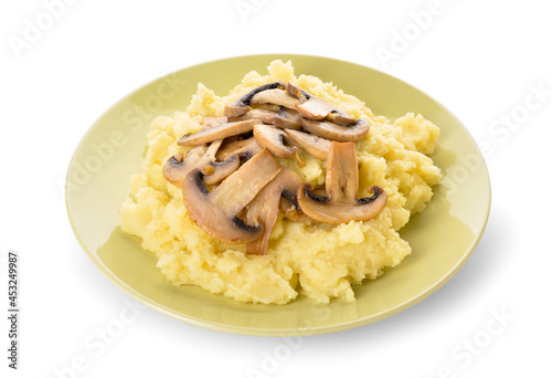 Plate with tasty mashed potatoes and mushrooms on white background