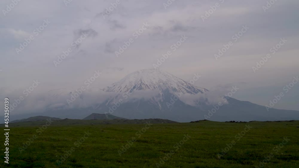 A cloudy landscape over the tolbachik volcano in Kamchatka, Russia. Timelapse video. A cloudy landscape over the tolbachik volcano in Kamchatka, Russia. Timelapse video.
