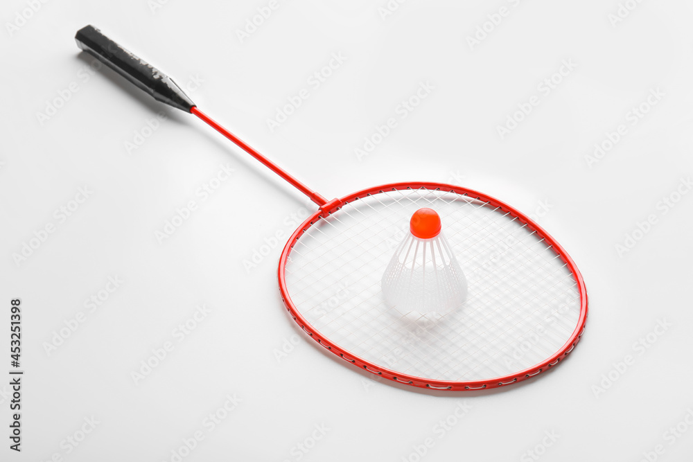 Badminton racket and shuttlecock on white background Badminton racket and shuttlecock on white background
