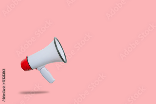 Business Communication and Marketing Concept : Red megaphone floating on floor for announcement and advertisement.
