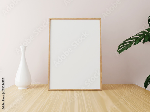Vertical wooden frame mockup on wooden table with vase and plants. 3d rendering.