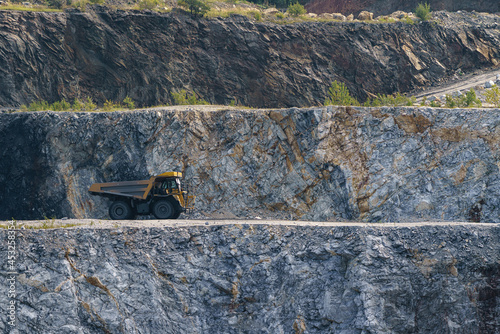 Dump truck in limestone mining, heavy machinery. Mining in the quarry.