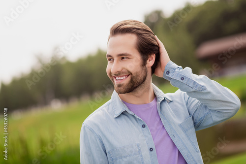 Photo of young good looking positive attractive male relaxing touch hair flirty coquettish enjoying summer vacation